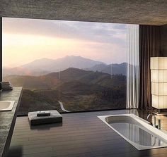 the bathroom is very large and has a huge window to look out over the mountains