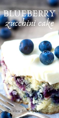 a close up of a piece of cake with blueberries on it