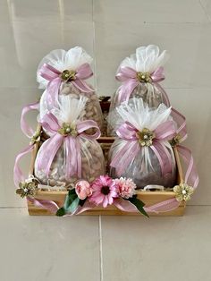 three bags filled with candy sitting on top of a tiled floor