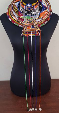 Maasai wedding necklace sets. This set is perfect for weddings, traditional events , African themed events etc. In this listing, you'll get 3 *leather beaded necklaces(with hanging strings) *4choker necklaces.(with chains) All necklaces are in different sizes and will layer nicely. The beads are firmly sewn into leather. Custom orders are welcome. More neckleces here; https://www.etsy.com/shop/TribalTess?ref=seller-platform-mcnav&section_id=21306083 Back to my shop; https://www.etsy.com/shop African Wedding Jewelry, Leather Beaded Necklace, African Beads Necklace, Wedding Necklace Set, African Earrings, African Necklace, Necklace Sets, Maasai, African Beads