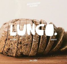 a loaf of bread sitting on top of a wooden cutting board with the word lungo written across it