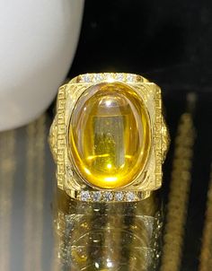 Vintage 15K 610 Yellow Gold Citrine Cabochon & White Topaz Tiger Ring ...Marked 610 and tested 15K Gold...Total of weights 18.2grams...Size 8.5...Measure of Face 24.5MM...It's in very good condition. Oval Gold Diamond Cabochons, Gold Polished Cabochons For Anniversary, Gia Certified Gold Gemstones For Formal Occasions, Collectible Gia Certified Gold Ring, Gold Oval Cabochon Gemstones For Anniversary, Gold Cabochon Gemstones For Anniversary, Gold Cabochon Gemstones For Wedding, Gold Gemstone Cabochons For Anniversary, Oval Cabochon Citrine Rings