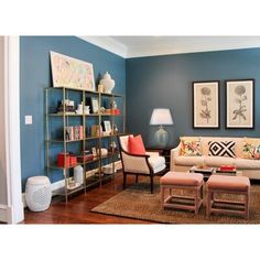 a living room with blue walls and furniture