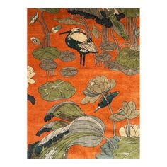 an orange rug with birds and water lilies