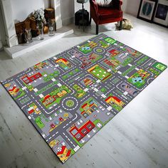 a child's play mat with cars and trucks on it in a living room