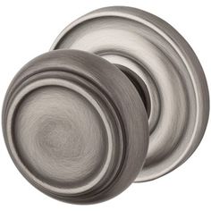 an image of two knobs on a door handle set in satin chrome finish, isolated against a white background