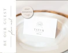 a close up of a white plate with a label on it and an empty place card