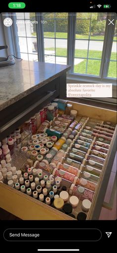 an open drawer filled with lots of paint