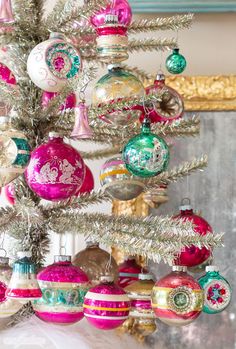 a christmas tree with ornaments hanging from it