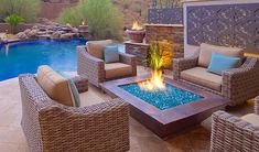 a fire pit sitting next to a swimming pool