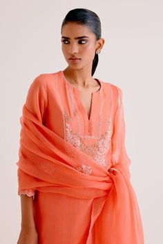 Orange silk chanderi kurta with floral thread embroidery. Paired with a pant and embroidered dupatta. - Aza Fashions Elegant Slub Silk Blouse Piece, Elegant Cutdana Kurta For Summer, Sheer Dupatta Blouse Piece For Eid, Transitional Cutdana Kurta, Elegant Chanderi Traditional Wear For Summer, Summer Wedding Cotton Silk Kurta, Elegant Summer Cutdana Set, Summer Kurta With Pallu, Elegant Traditional Wear With Sheer Dupatta For Summer