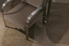 a chair sitting on top of a carpet covered floor