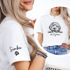 a woman wearing a white shirt with a dog on it