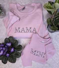 Mama Floral Sweatshirt This Mama Floral Sweatshirt is a must-have for any stylish mom out there! The beautiful floral design adds a touch of femininity to this cozy sweatshirt, making it perfect for both casual outings and lounging around the house. Mini Floral Sweatshirt Dress your toddler in our Mini Floral sweatshirt. This adorable sweatshirt is cozy and warm and designed with a floral pattern that will have your little one looking cute and fashionable.  Welcome to The Threaded Daisy store. Thank you for visiting!  Production & Shipping: Everything is embroidered to order just for you. On average your items will be shipped out within 3-5 days of ordering. The estimated shipping time in the US is 5-7 business days. Washing Instructions: Wash inside out, in cold water, on gentle cycle.  T Ligonier Pa, Mama And Mini, Floral Sweatshirt, Embroidered Shirts, Stylish Mom, Personalized Clothes, Embroidered Clothes, Cozy Sweatshirts, Embroidered Sweatshirts