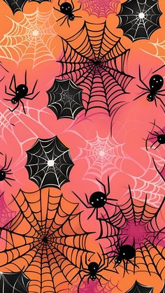 halloween spider webs and bats on an orange, pink, and black background with white stars