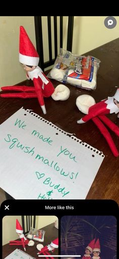 two elfs sitting at a table with a note written on it