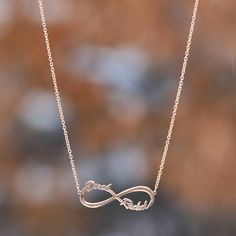 How sweet is this Infinity Name Necklace? It is a stylish design that looks stunning on its own or layered with other necklaces for a bolder look. From a delicate, but strong chain, hangs an infinity pendant that can be personalized with two words. Some great options include names, inspirational words, and short messages. Personalized jewelry is wonderful because it is unique and has meaning to the wearer. As a sweet gift idea, BFFs or couples could get their names put on one infinity symbol. Th Name Necklace Silver, Sweet Gift Ideas, Infinity Pendant, Short Messages, Infinity Necklace, Infinity Symbol, Custom Name Necklace, Valentines Jewelry, Valentines Gifts For Her