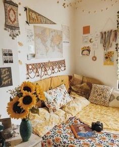 a sunflower is sitting on the bed in a room with many pictures and decorations