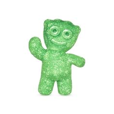 a small green teddy bear with eyes and mouth on it's back, standing upright