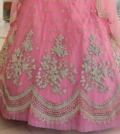 COLOR : Shimmering Blush Pink FABRIC : Top (Blouse) - Soft Net, Bottom (Lehenga) - Soft Net, Dupatta - Soft Net WORK : Heavy Metallic Thread Embroidery, Zari Work, Cutwork, Sequins, Motifs, Lace Border OCCASION : Wedding, Reception, Sangeet, Engagement READY-TO-WEAR : NoSTITCHING : Available as semi-stitched fabric, can be stitched using standard size option (+$30). Note: There might be a slight color variation due to lighting and flash used during photoshoot. The bright shade seen is the best c Pink Embroidered Fabric With Pallu For Reception, Pink Bollywood Gown With Dori Work, Pink Dori Work Gown For Wedding, Pink Sets With Intricate Embroidery In Traditional Drape, Pink Embroidered Fabric With Dori Work For Reception, Pink Ceremony Dress With Intricate Embroidery, Ceremonial Semi-stitched Zari Work Choli, Ceremony Embroidered Semi-stitched Saree, Semi-stitched Choli With Dupatta For Ceremonies