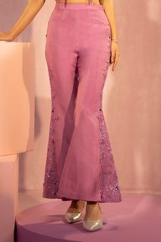 Light purple padded top with floral patchwork, cutdana embroidery on collar. Paired with embroidered pant. - Aza Fashions Fitted Pink Bottoms With Floral Embroidery, Fitted Pink Embroidered Pants, Fitted Embroidered Pink Pants, Fitted Floral Embroidery Trousers, Fitted Trousers With Floral Embroidery, Spring Fitted Pants With Resham Embroidery, Fitted Pants With Resham Embroidery For Spring, Fitted Embroidered Straight Pants, Fitted Cotton Bottoms For Festive Season