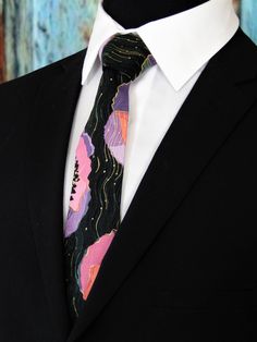 "This is a unique men's metallic floral necktie. features a black background with gold metallic along with pink, purple, lavendar and black floral pattern. Pocket Square available upon request pending available of fabric. Cost is $10.99 Message me to check availability. Expertly hand-made from 100% cotton you can select your length from 57\" to 71\" (Great for taller Men). Width is standard 3.5\" as shown here or skinny 2.5\". If you require a custom length or width, please contact us. 2.5\" x 4 Black Background With Gold, Make A Tie, White Goth, Blue Necktie, Floral Necktie, Black Floral Pattern, Goth Wedding, Tie Men's, Black Skulls