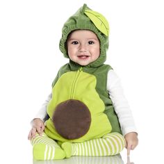 a baby sitting on the floor wearing a costume