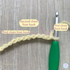 the crochet hook is being used to make a chain with two different hooks