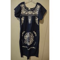 This Beautiful Navy Blue Dress Is A Must-Have Addition To Any Disney Parks Fan's Wardrobe. The Dress Features Intricate Embroidery And Is Made In Mexico With High-Quality Materials. The Dress Is A Size Small And Has A Blouson Style With A Midi-Length Hem. The Dress Is Perfect For Any Occasion And Can Be Dressed Up Or Down Depending On Your Preference. The Dress Is A Great Way To Show Off Your Love For Disney Parks While Also Looking Stylish And Chic. Don't Miss Out On This Amazing Dress! Casual Blue Dress With Embroidered Hem, Casual Blue Dress With Floral Embroidery, Fitted Casual Blue Embroidered Dress, Blue Fitted Short Sleeve Embroidered Dress, Fitted Blue Embroidered Casual Dress, Blue Fitted Embroidered Dress With Short Sleeves, Fitted Blue Embroidered Dress With Short Sleeves, Blue Embroidered Short Sleeve Dress, Navy Embroidered Dress