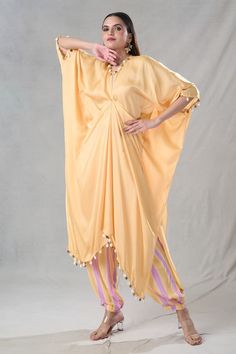 Yellow kaftan tunic featuring shell and coins detailing on the hem with a cut-out neckline. Paired with a stripe pattern pant. - Aza Fashions Summer Palazzo Set With Tassels, Yellow Kaftan, Kaftan Tunic, Jayanti Reddy, Anushree Reddy, Rohit Bal, Yellow Pants, Tarun Tahiliani, Type Of Pants