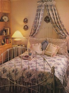 a bedroom with a bed, dresser and lamp in it's centerpieces