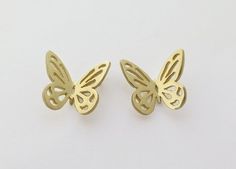 Solid 14k gold butterfly stud earrings.Beautiful and delicate solid gold butterflies, with a lacy pattern cut in their wings.The butterfly is a symbol of transformation, femininity, grace, joy,  and freedom. You can see how the earrings would look on an ear, in the last photo. The earrings in the last photo are made of sterling silver, and you can find them here:https://www.etsy.com/listing/194920687/butterfly-earrings-lacy-butterfly-studs?ref=shop_home_active_11The butterfly measures 1.5 cm/ 0. Elegant Pierced Butterfly Jewelry, 14k Gold Butterfly Earrings With Charm, 14k Gold Butterfly Charm Earrings, 14k Gold Butterfly Earrings With Butterfly Charm, Yellow Gold Butterfly-shaped Pierced Earrings, Hypoallergenic Butterfly Yellow Gold Jewelry, Hypoallergenic Butterfly-shaped Yellow Gold Jewelry, Hypoallergenic Yellow Gold Butterfly Jewelry, Luxury Yellow Gold Butterfly Earrings