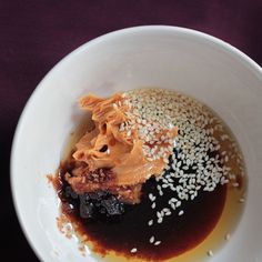 a white bowl filled with different types of food