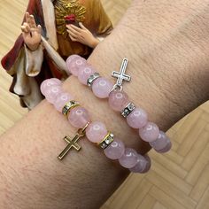 "These elegant Stretchy bracelets with rose quartz beads are handmade personally by me, Derlis. You can pick your size bracelet and your favorite cross charm: silver or golden tone finish. Also, you can get the set of 2, or each individually. These bracelets are the perfect gift for First Holy Communion, Baptisms, Confirmations, of friends, family members. Also, perfect gift for anyone who loves handmade jewelry on birthdays, Valentine's Day Mother's Day Prom, graduation, or any other memorable Rose Quartz Beads, Rose Quartz Stone, Catholic Gifts, Gift For Girls, Cross Bracelet, Stretchy Bracelets, Holy Communion, Bead Stringing, Cross Charms