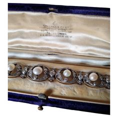 Exquisite Collector Edwardian/Belle Epoque Natural Pearl and Diamond Bracelet, fitted in its original case by Garrard & Co, circa 1900. The first official Crown Jeweler for the British royal family, Garrard & Co. Limited has crafted iconic and historically celebrated rings, watches, necklaces and other jewelry for centuries. An Edwardian pearl and diamond bracelet, consisting of eight oval-shaped diamond-set openwork links, each to the centre with a round natural pearl set between two old-cut di Antique Formal Bracelets With Box Clasp, Victorian White Gold Bracelets For Formal Occasions, Victorian Style White Gold Bracelets For Formal Occasions, Victorian Bracelets With 17 Jewels For Evening, Vintage Formal Bracelet With Box Clasp, Antique Evening Bracelets, Victorian Bracelets For Anniversary, Edwardian Jewelry, Royal Jewelry