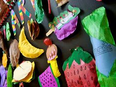 there are many different items on the wall in this room, including paper plates and strawberries