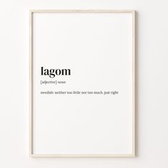 a white framed print with the words lagom on it