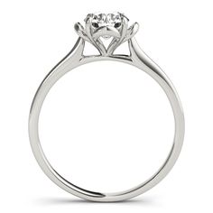 a white gold engagement ring with a round diamond center