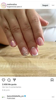 a woman with pink and white french manies on her nails