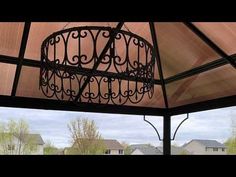 the inside of a gazebo with a chandelier hanging from it