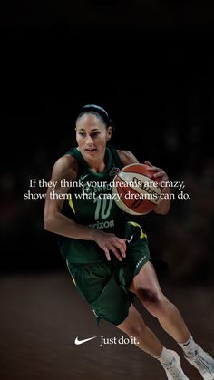 a woman is running with a basketball in her hand and the words, if they think your friends are crazy show them what crazy dreams can do