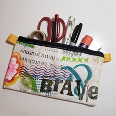 Hand-painted on unprimed canvas bag original art by Nathalie.  This cute little artsy, messy painted, zipper pouch is just the right size to carry pencils, pens, a cell phone, a small wallet, a tube of lipstick, or any other goodies you can think of.  The pouch is 5 inches tall and 8 inches long.  As I am working on other art projects, I keep a couple of yards of unprimed canvas-like fabric close by to clean my brushes. After it is messy enough I add markings and designs with brushes, stencils, and stamps. It is great messy, artsy fun Multicolor Zipper Pouch Pencil Case For Crafting, Artistic Pencil Case With Zipper For Daily Use, Artistic Multicolor Pencil Case For Gift, Artistic Multicolor Pencil Case As Gift, Artistic Multicolor Pencil Case Gift, Artistic Zipper Pencil Case As Gift, Artistic Pencil Case With Pen Slots, Artistic Pencil Case With Pen Holders For Daily Use, Artistic Pencil Case For Everyday Use