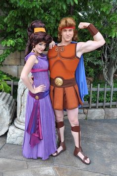 two people in costumes posing for the camera