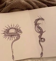 an open book with drawings of snakes and sunflowers on the pages next to each other