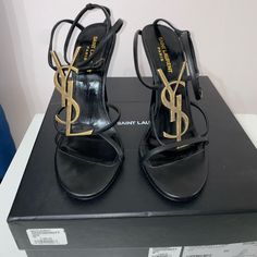 Authentic Cassandra Sandal. This Is The Strappy Version Where The Heel Is Uncovered. Worn Less Than 5 Times. Box And Dust Bags Included. Designer Ankle Strap Heels With Heel Loop, Luxury Flat Heels For Evening, Luxury Evening Flats, Designer Flats With Removable Insole, Designer Flat Heel Sandals For Formal Occasions, Designer Formal Flat Heel Sandals, Designer Closed Toe Sandals With Wrapped Heel, High-end Leather Open Toe Heels, High-end Open Toe Leather Heels