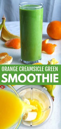 orange creamsice green smoothie in a blender with an orange slice next to it