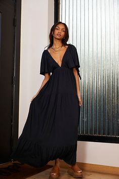 Forever free and flowy, this effortless maxi dress from our FP Beach collection is featured in a V-neck, tiered silhouette with flutter sleeves for added shape. * Soft, textured fabrication * Elastic empire waist* Effortless, pull-on style Free People Maxi, Maxi Robes, Midi Dress Summer, Lace Maxi, Flowy Dress, Shop Maxi Dresses, Summer Maxi Dress, Tee Dress, Flutter Sleeves