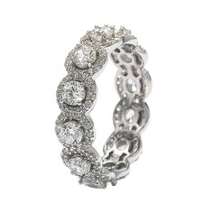 This sophisticated Suzy Levian eternity ring features round-cut white cubic zirconia gemstones, framed by sparkling pave-set white cubic zirconia stones. These gemstones are hand set in 925 sterling silver. Surprise someone special in your life with this luxurious anniversary ring. The perfect gift that is not only strikingly gorgeous but also reminds your special someone that your love lasts for all eternity. The Suzy Levian brand guarantees the finest craftsmanship and confirm that each and ev Levian Jewelry, Gemstone Brooch, Cubic Zirconia Bracelet, Cubic Zirconia Necklace, Cubic Zirconia Jewelry, Cubic Zirconia Earrings, Band Jewelry, Creating Jewelry, Jewelry Rings Diamond