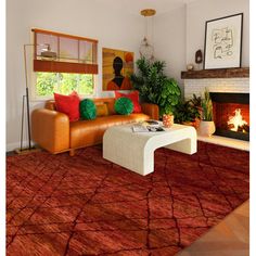 a living room filled with furniture and a fire place in front of a large window