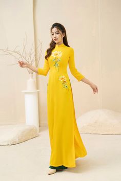 Vietnamese Ao Dai with sharp 3D printed motifs on silk fabric. Slim and lightweight design enhances the female figure. High quality silk material, slight stretch, very light and comfortable to wear. Fitted Maxi Dress With Floral Embroidery, Full Length Floral Embroidered Dress, Full Length Silk Dress For Spring, Spring Floral Embroidered Full Length Dress, Full Length Spring Dress With Floral Embroidery, Spring Floral Embroidery Full Length Dress, Traditional Long Maxi Dress For Spring, Yellow Long Sleeve Ao Dai For Spring, Fitted Ao Dai With Floral Print For Spring